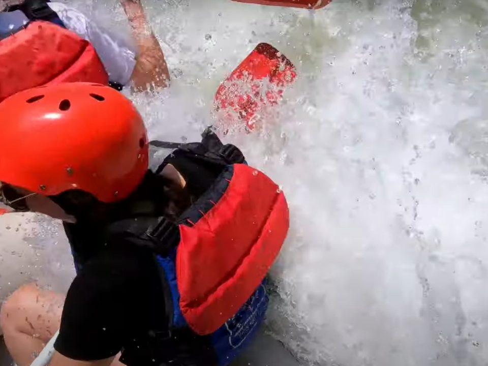 Raft crashing through the second ledge of the Flipper rapid on the Middle Ocoee River