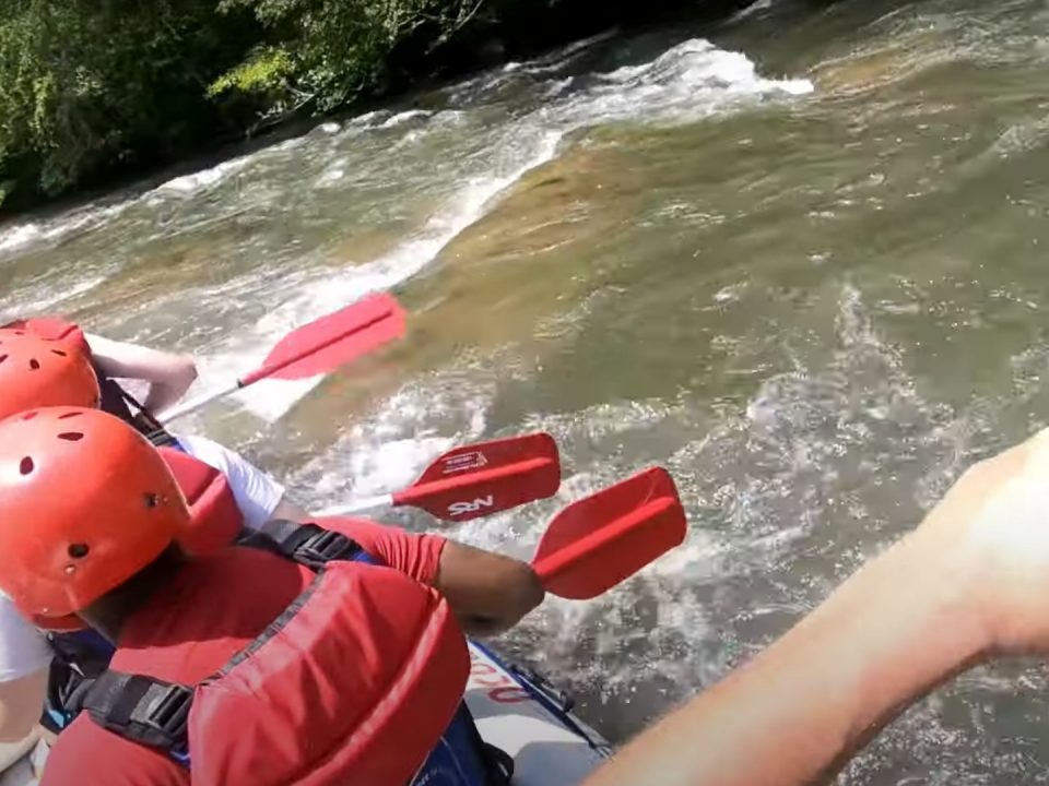 Navigating the shallow shoals of Hiwassee Shoals in a commercial raft