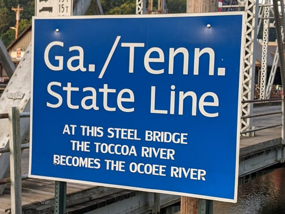 Blue sign at steel bridge on the GA/TN border.